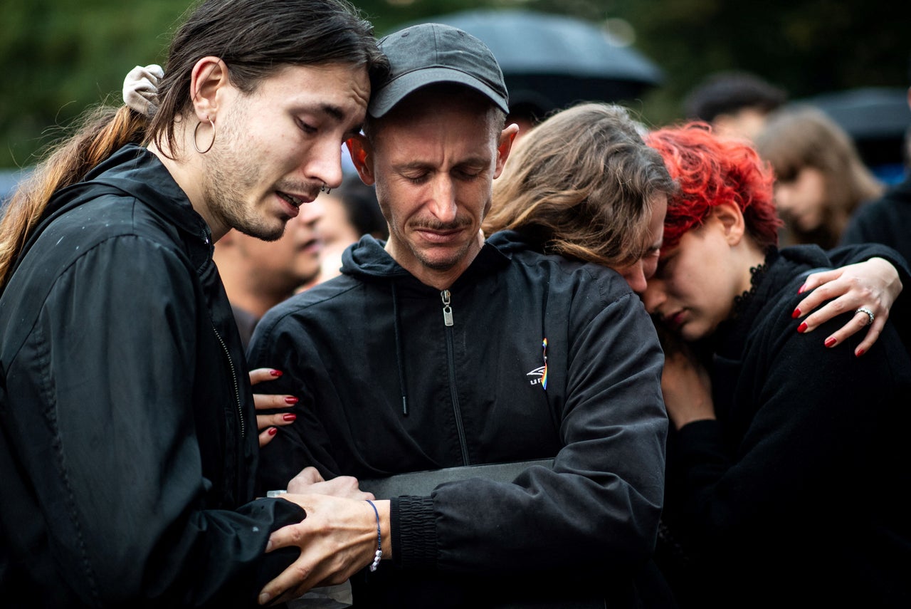 Participants embrace during a protest in downtown Bratislava on Oct. 14, 2022, two days after a radicalised teenager shot dead two men at a gay bar.