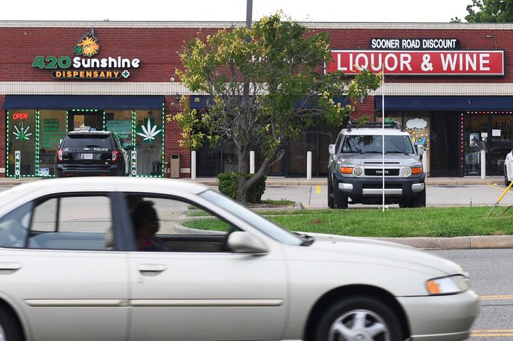 A medical marijuana dispensary sits next to a liquor store in Oklahoma City in July 2021. As of early February 2023, Oklahoma had more than 2,800 licensed dispensaries. 