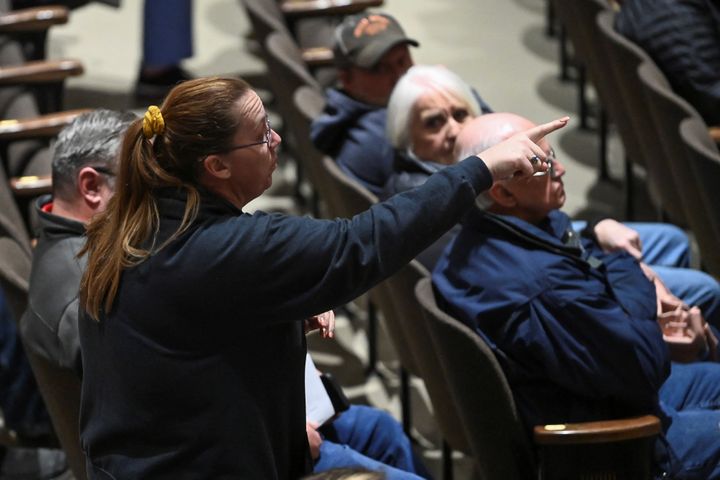 A woman points her finger during a town hall held by the U.S. Environmental Protection Agency (EPA), in East Palestine, Ohio, on March 2, 2023.