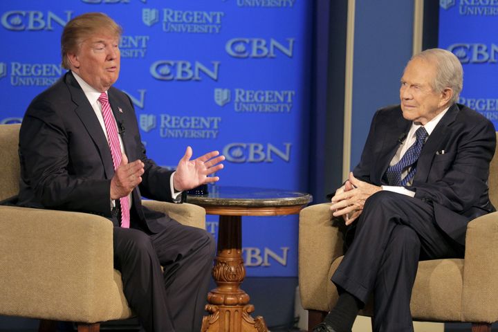 Donald Trump (left), then a GOP presidential candidate, speaks with Robertson at a campaign event at Regents University in Virginia Beach, Virginia, in February 2016. 