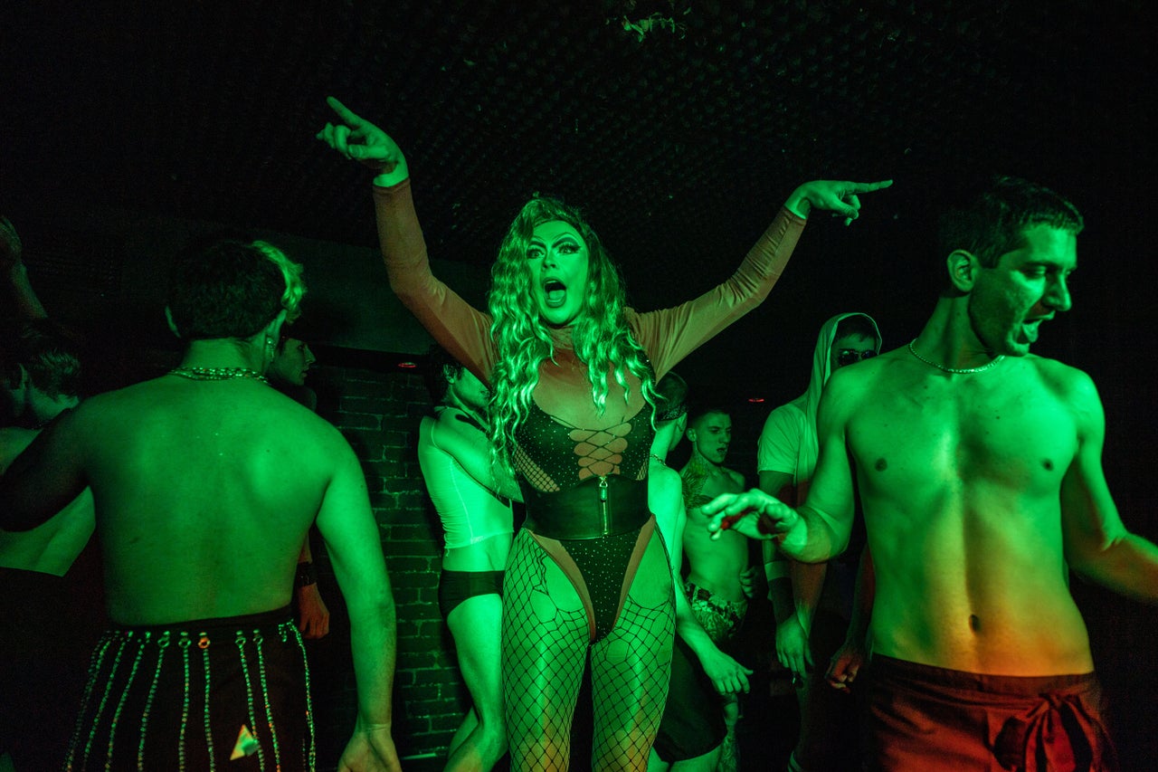 Drag queen Biologiy, center, performs with the Go-Go GIANNI Boys.