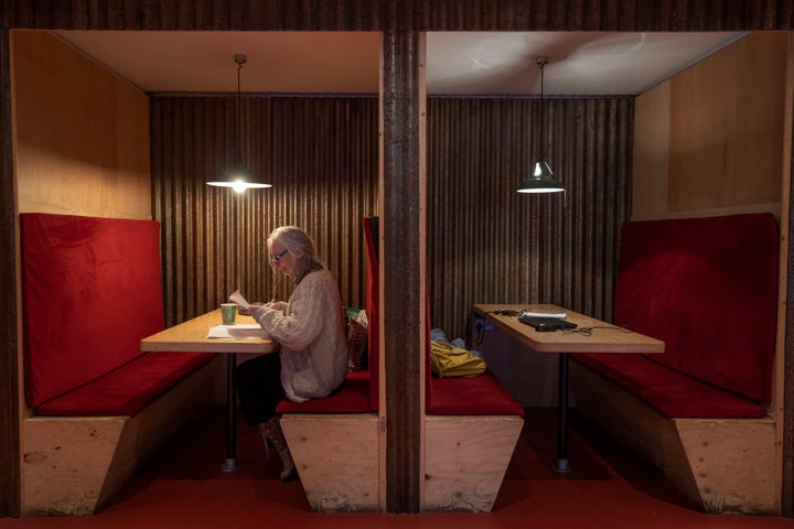 The foyer of the Other Place theater in Shakespeare's birthplace of Stratford-upon-Avon is a cozy refuge from winter. One day a week the theater becomes a "warm hub," set up by the Royal Shakespeare Company to welcome people who may be struggling to heat their homes because of sky-high energy prices.