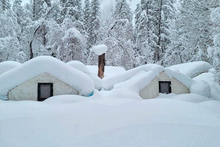 In this photo provided by the National Park Service, tents at Curry Village are covered with snow in Yosemite National Park, California, Tuesday, Feb. 28, 2023.