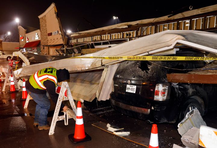 The roof of La Azteca grocery store on W. Eldorado Parkway peeled off and landed on a half dozen vehicles parked outside as a line of powerful thunderstorms rolled through Little Elm, Texas, on Thursday, March 2, 2023.