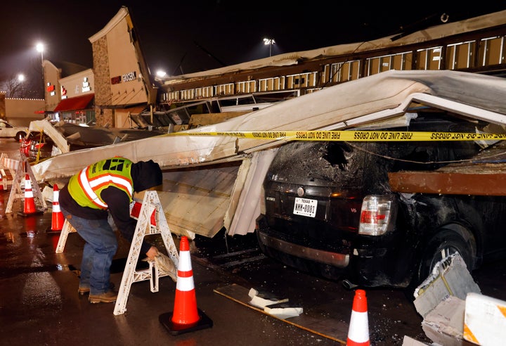 The roof of La Azteca grocery store on W. Eldorado Parkway peeled off and landed on a half dozen vehicles parked outside as a line of powerful thunderstorms rolled through Little Elm, Texas, on Thursday, March 2, 2023.