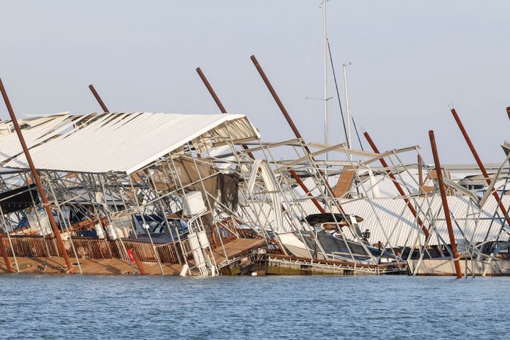 Docks and boats are upended at Lake Lewisville marina in Lewisville, Texas, Friday, March, 3, 2023, after a severe storm moved through the area the night before.