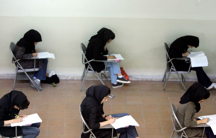 TOPSHOT - Iranian high school students sit for their university entrance examination in Tehran on June 25, 2009. Iran has jailed more than 140 political activists, journalists and university lecturers since the disputed election which returned President Mahmoud Ahmadinejad to power, reports said. AFP PHOTO/ISNA/MONA HOOBEHFEKR (Photo by MONA HOOBEHFEKR / ISNA / AFP) (Photo by MONA HOOBEHFEKR/ISNA/AFP via Getty Images)