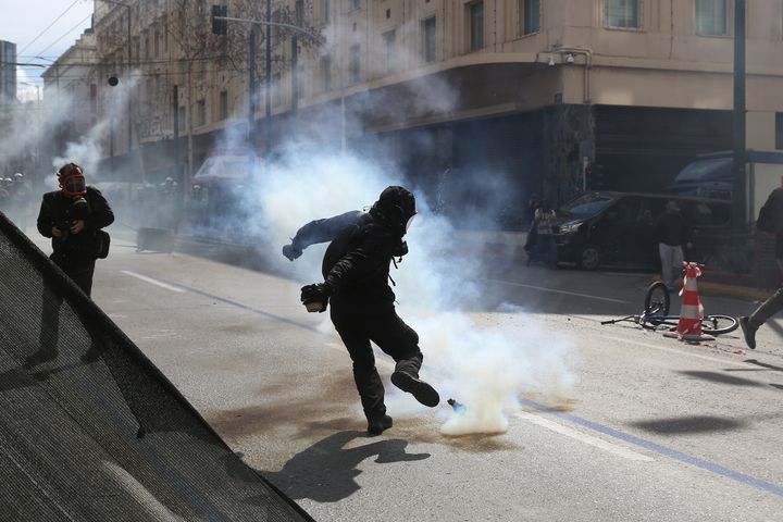 Clashes between protesters and riot police during a demonstration, after a collision between two trains, near the city of Larissa, in Athens, Greece on March 05, 2023.