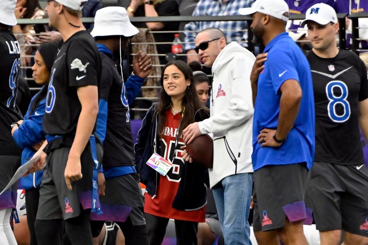 Chase Sui Wonders and Pete Davidson stand on the sidelines during the flag football event at the NFL Pro Bowl last month.