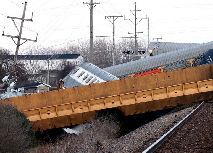 Multiple cars of a Norfolk Southern train lie toppled on one another after derailing at a train crossing with Ohio 41 in Clark County, Ohio, on March 4, 2023. 