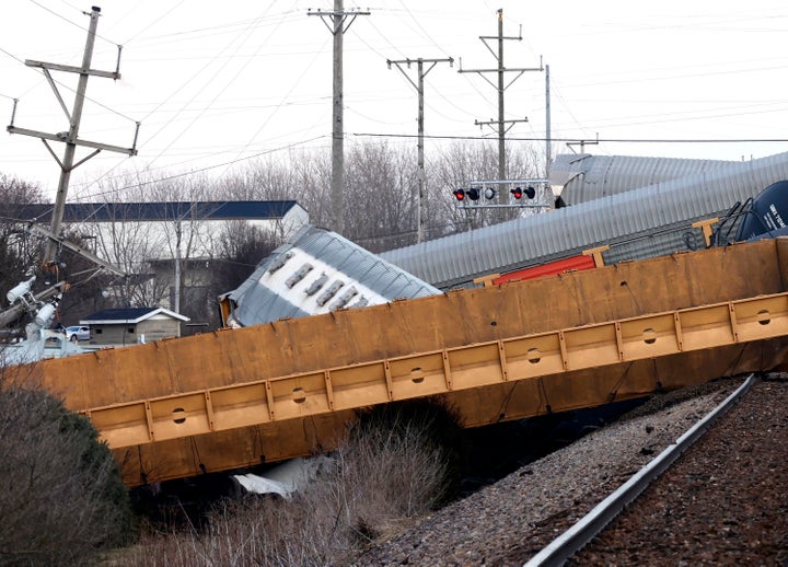 Multiple cars of a Norfolk Southern train lie toppled on one another after derailing at a train crossing with Ohio 41 in Clark County, Ohio, on March 4, 2023.