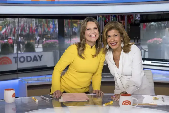 Co-anchors Savannah Guthrie, left, and Hoda Kotb pose on "Today" show set at NBC Studios on June 27, 2018, in New York.