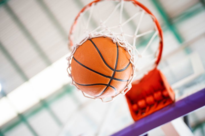 Basketball falling through hoop