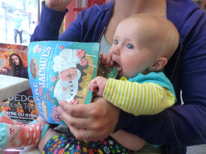 The author in her favorite maternity hoodie with her daughter, age 5 months.