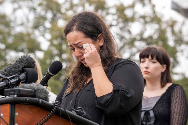 Anna Zargarian, one of the plaintiffs, wipes away tears outside the Texas Capitol as she recounts what happened to her when she needed an abortion.