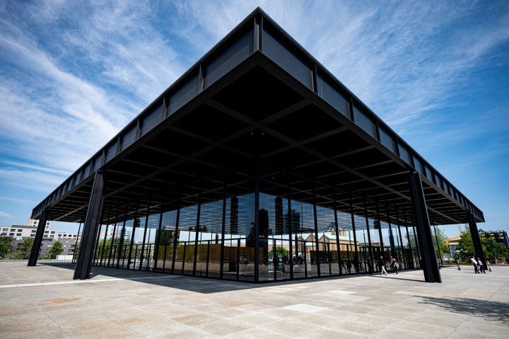 05 June 2021, Berlin: Visitors stand in front of the Neue Nationalgalerie during open days. The iconic building was created by architect Ludwig Mies van der Rohe. A team led by British star architect David Chipperfield has renovated and refurbished the building at a cost of 140 million euros. Photo: Fabian Sommer/dpa - ATTENTION: Only for editorial use in connection with current reporting on the open days and only with full mention of the architect Ludwig Mies van der Rohe. (Photo by Fabian Sommer/picture alliance via Getty Images)