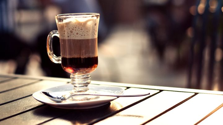 One of the keys to a perfect Irish coffee is getting the whipped cream to float on the top. There's a secret that'll help.