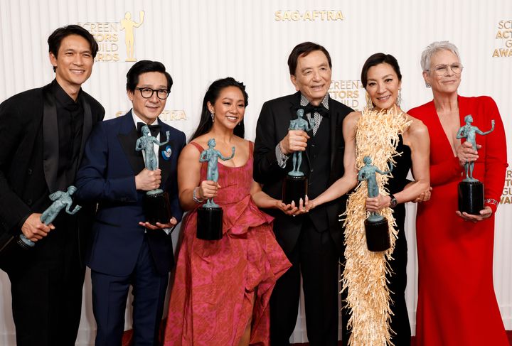 The cast of "Everything Everywhere All At Once" — Harry Shum Jr., Ke Huy Quan, Stephanie Hsu, James Hong, Michelle Yeoh, and Jamie Lee Curtis — at the Screen Actors Guild Awards on Feb. 26. (Photo by Frazer Harrison/Getty Images)