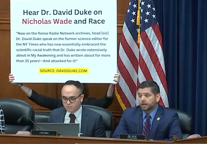 Rep. Raul Ruiz (D-Calif.) displays a poster with a quote on it from former Ku Klux Klan grand wizard David Duke, praising the work of Nicholas Wade, whom the GOP invited to testify on COVID's origins.