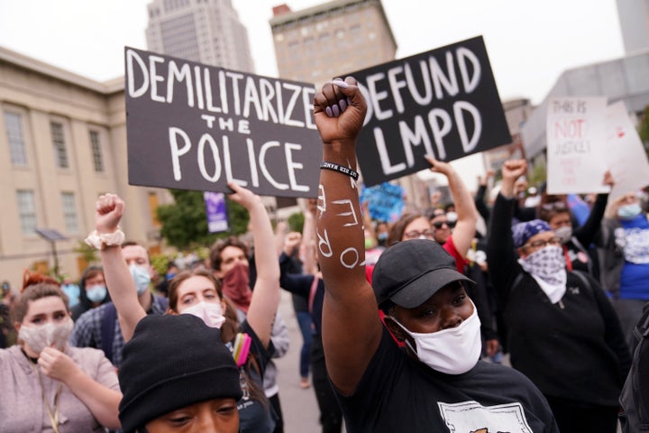 Protesters react to a grand jury indicting one officer involved in the shooting of Breonna Taylor on Sept. 23, 2020, in Louisville.