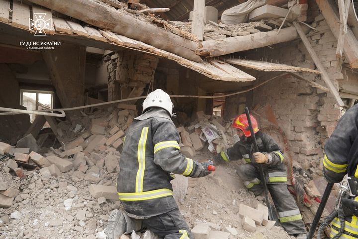 Rescuers work at a site of residential buildings destroyed by a Russian missile strike in the Lviv region, Ukraine, on March 9, 2023.