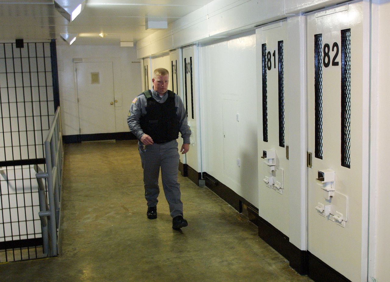 A guard walks the hallway of Texas' death row.
