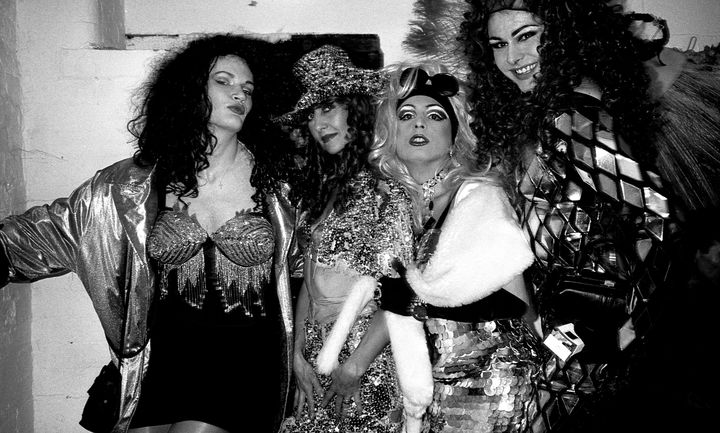 Drag queens and a friend hang out before a fashion show at Flesh in the Hacienda, Manchester 1989