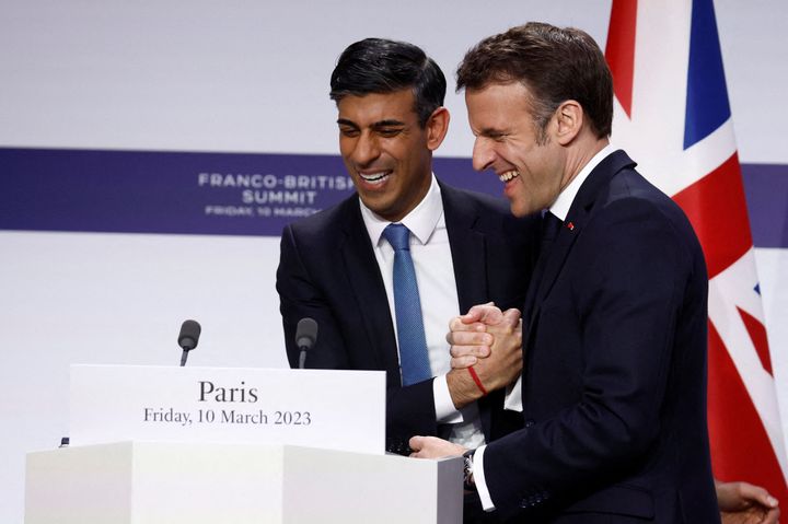 French president Emmanuel Macron shakes hands with UK PM Rishi Sunak at the end of their Paris press conference 
