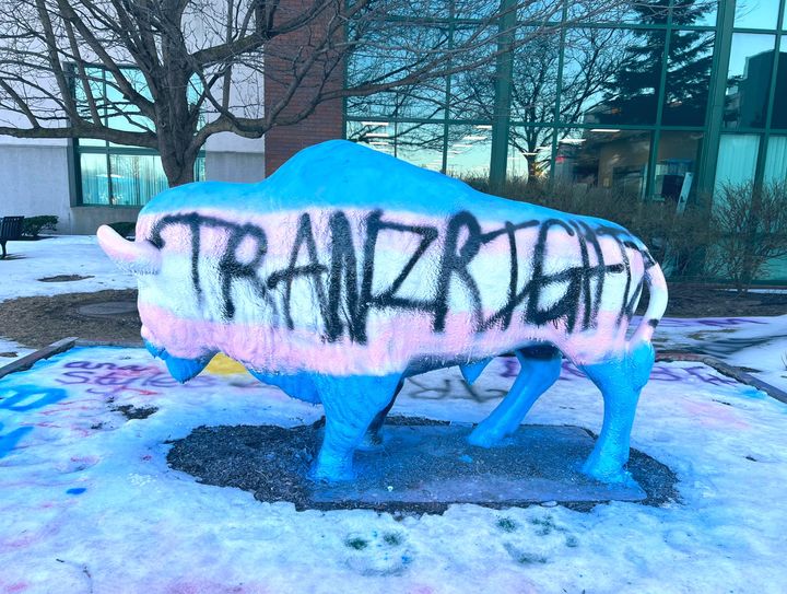 A Buffalo statue on the campus of the University at Buffalo in Buffalo, N.Y., is graffitied with pro-trans messages on March 9, 2023. Students turned out in the hundreds to protest Michael Knowles, the far-right pundit who called for "transgenderism" to be "eradicated."