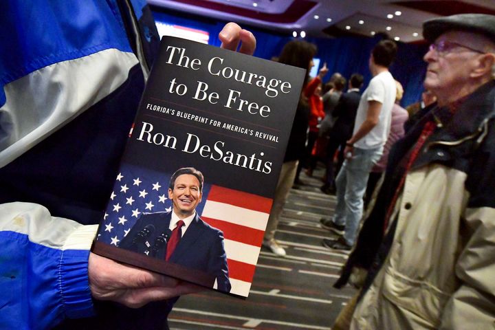 Copies of Florida Gov. Ron DeSantis's book "The Courage to Be Free" are given away before he speaks at an event Friday, March 10, 2023, in Davenport, Iowa. (AP Photo/Ron Johnson)