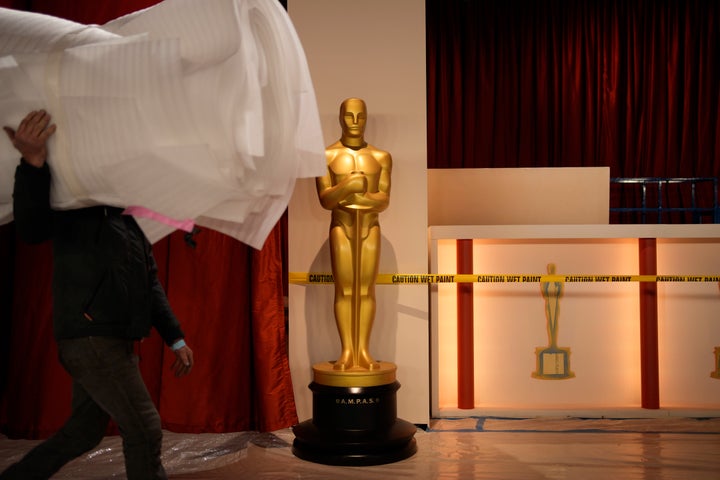 Workers ready the carpet during preparations for Sunday's 95th Academy Awards, Friday, March 10, 2023, in Los Angeles. (AP Photo/John Locher)