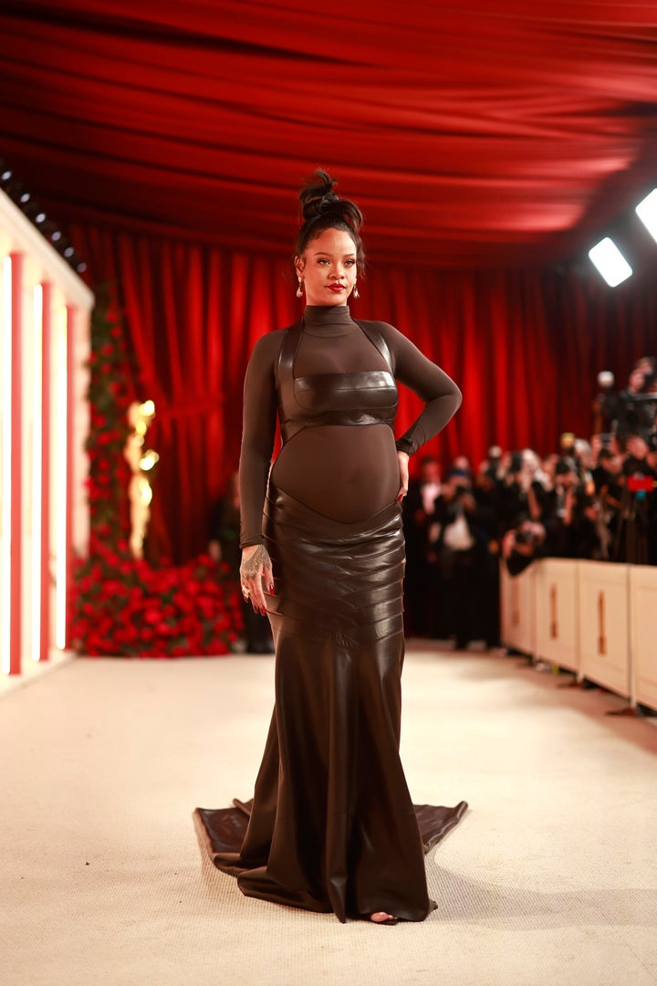 The singer showcased her pregnant body at Sunday night’s Oscars in a sleek black leather and mesh gown by Alaïa.