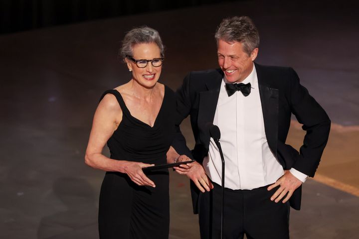 Andie MacDowell and Hugh Grant on stage at the Oscars