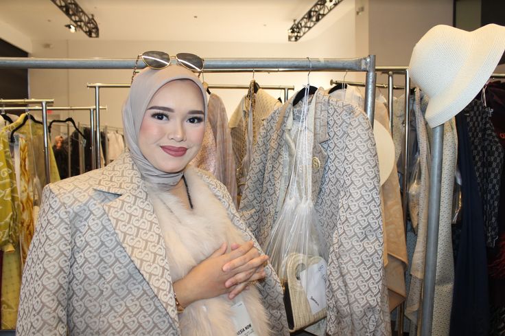 Linda Anggrea, the designer and CEO of Buttonscarves, with her pieces backstage.