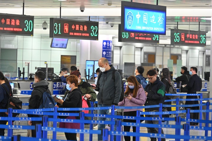 Travellers queue up to go through passport control at Shanghai Pudong International Airport on March 12, 2023 in Shanghai, China. The number of cross-border tourists at Shanghai Pudong International Airport has steadily increased since China optimized its epidemic prevention and control measures.