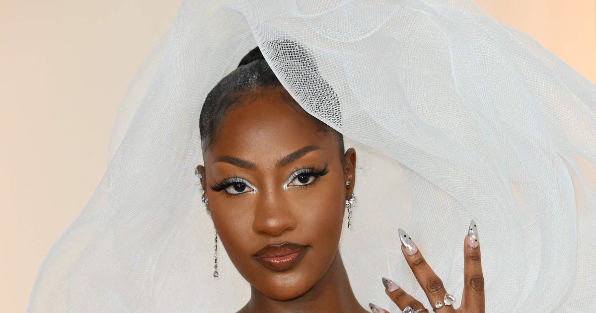 NextImg:Tems' Stunning Oscars Gown Sparks Chatter About View-Blocking Ensembles