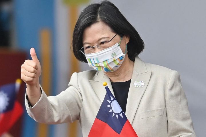 Taiwanese President Tsai Ing-wen gives a thumbs-up sign as she attends a ceremony to mark the island's National Day in front of the Presidential Office in Taipei on Oct. 10, 2022.