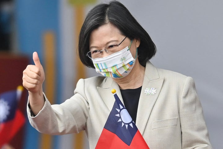 Taiwanese President Tsai Ing-wen gives a thumbs-up sign as she attends a ceremony to mark the island's National Day in front of the Presidential Office in Taipei on Oct. 10, 2022.