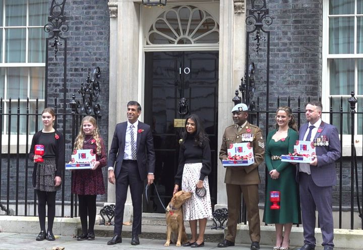 Rishi Sunak with his wife Akshata Murthy, outside 10 Downing Street as they purchase a poppy collar for their dog Nova from the Royal British Legion Poppy Appeal in October.