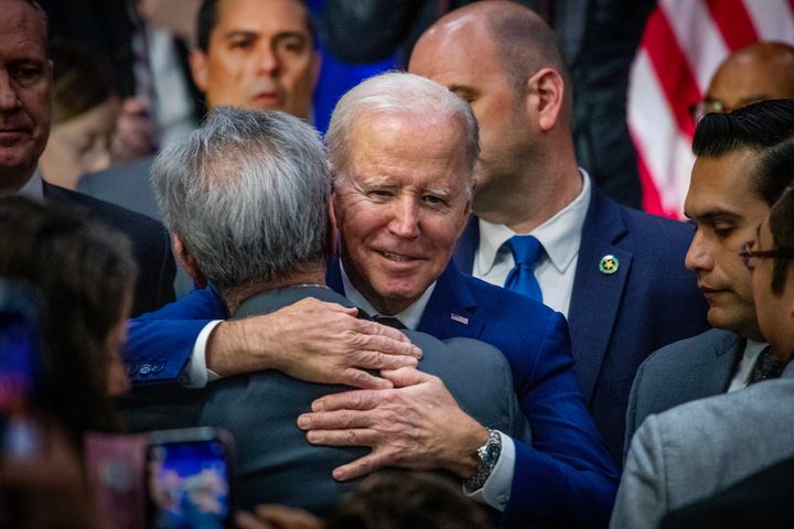 President Joe Biden hugs a Monterey Park community member at the Boys and Girls Club of West San Gabriel Valley in Monterey Park, California, on March 14, 2023, after announcing that he signed an executive order aimed at increasing background checks to buy guns.