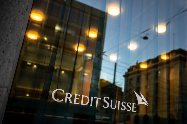 A sign of Credit Suisse bank is seen on the branch building in Geneva.