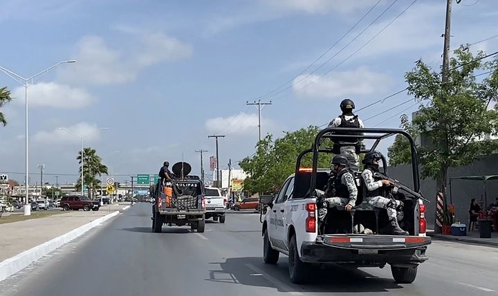 National Guard and military vehicles assist in transferring two of four kidnapped U.S. citizens back to Brownsville, Texas, after the other two were found dead in Matamoros, Tamaulipas, on March 7.