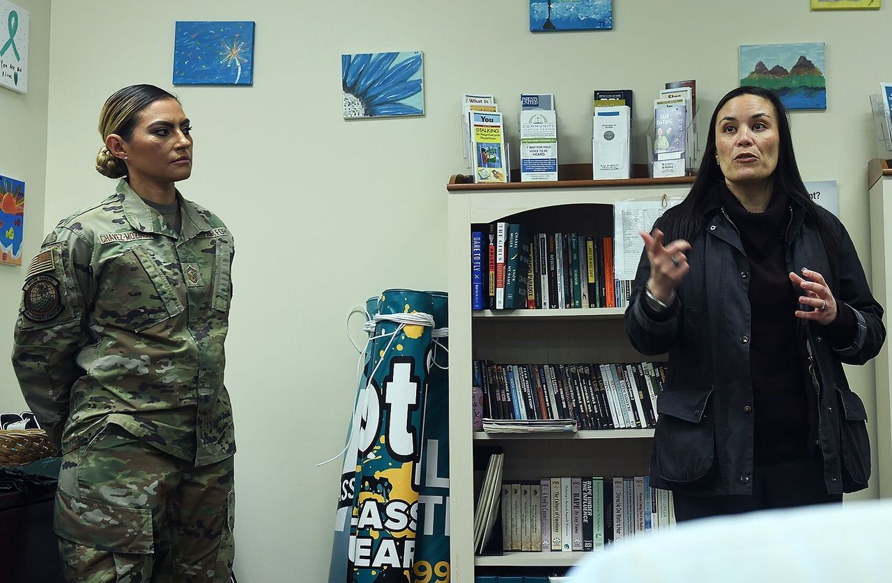 Jones, at right, visits the integrated response center at Offutt Air Force Base in Nebraska in January. It's one of seven bases chosen for a pilot program that creates a hub of support services for survivors of domestic violence.