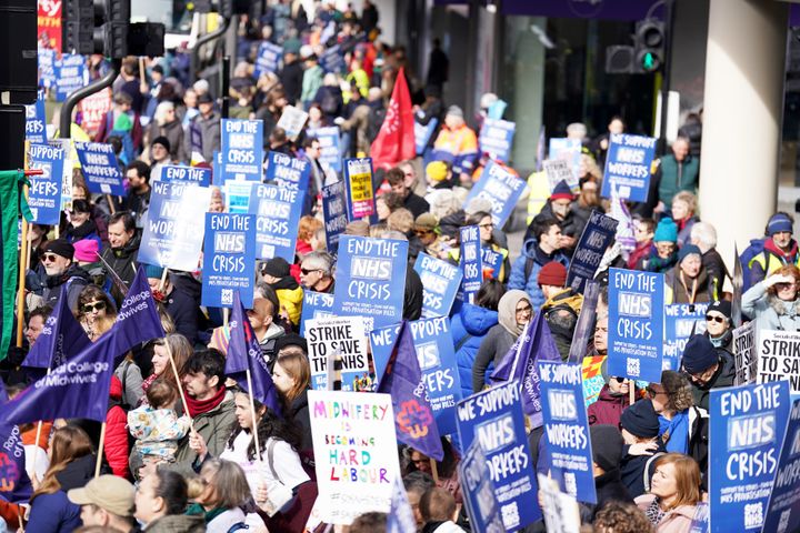 People gather on Warren Street in London, ahead of a Support the Strikes march in solidarity with nurses, junior doctors and other NHS staff following recent strikes over pay and conditions.