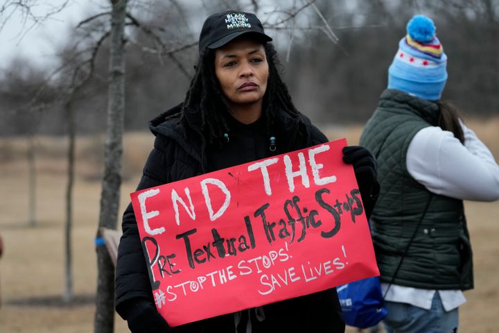 A person holds a sign as a group of demonstrators gather at dusk in Shelby Farms Park in response to the death of Tyre Nichols, who died after being beaten by Memphis police officers following a traffic stop, in Memphis, Tennessee, on Jan. 30. Nichols, who had a hobby in photography, frequented the park to photograph sunsets.