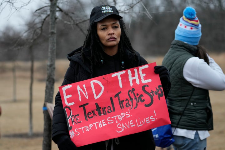 A person holds a sign as a group of demonstrators gather at dusk in Shelby Farms Park in response to the death of Tyre Nichols, who died after being beaten by Memphis police officers following a traffic stop, in Memphis, Tennessee, on Jan. 30. Nichols, who had a hobby in photography, frequented the park to photograph sunsets.