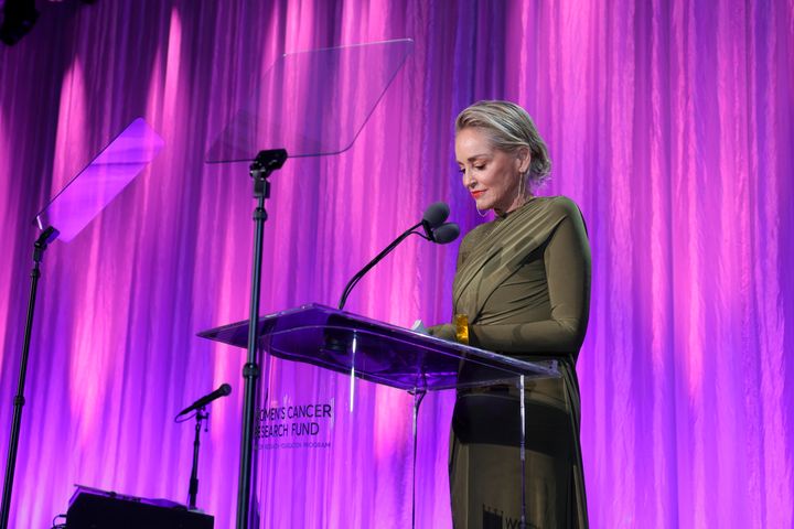 Sharon Stone tearfully encouraged a crowd to donate to the Women’s Cancer Research Fund on Thursday, while describing what she said were her financial losses in "this banking thing."
