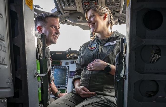 Air Force Major Lauren Olme and her husband, also an Air Force pilot, sit in the cockpit of a B-1B Lancer at Dyess Air Force Base, Texas, Feb. 20. Olme can continue flying after getting approved under the Air Force’s new guidance that allows female pilots to voluntarily request to fly during pregnancy -- meaning female pilots no longer have to choose between advancing their career and having a family.