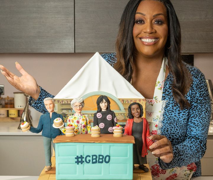 Alison Hammond with cake versions of her new Bake Off co-stars