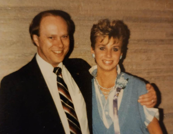 The author, age 14, with her father.